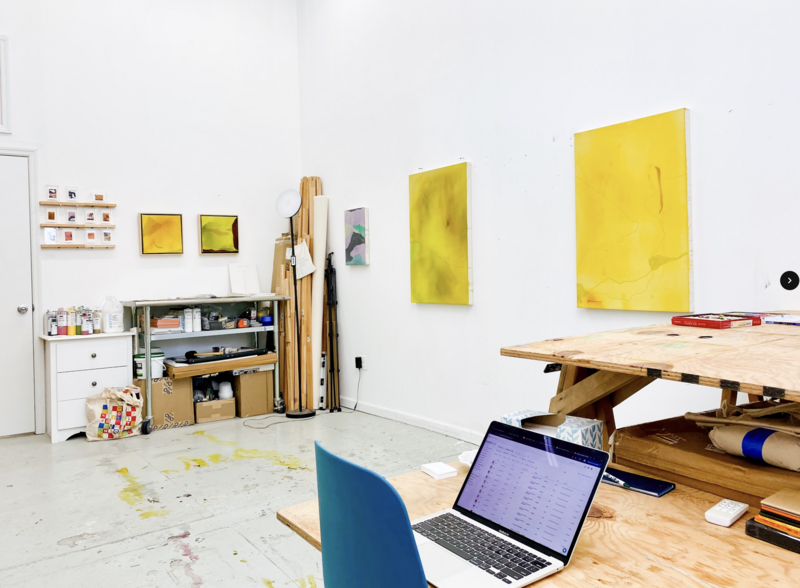 The Studio of Mel Reese with a desk, computer, and shelves with materials. 